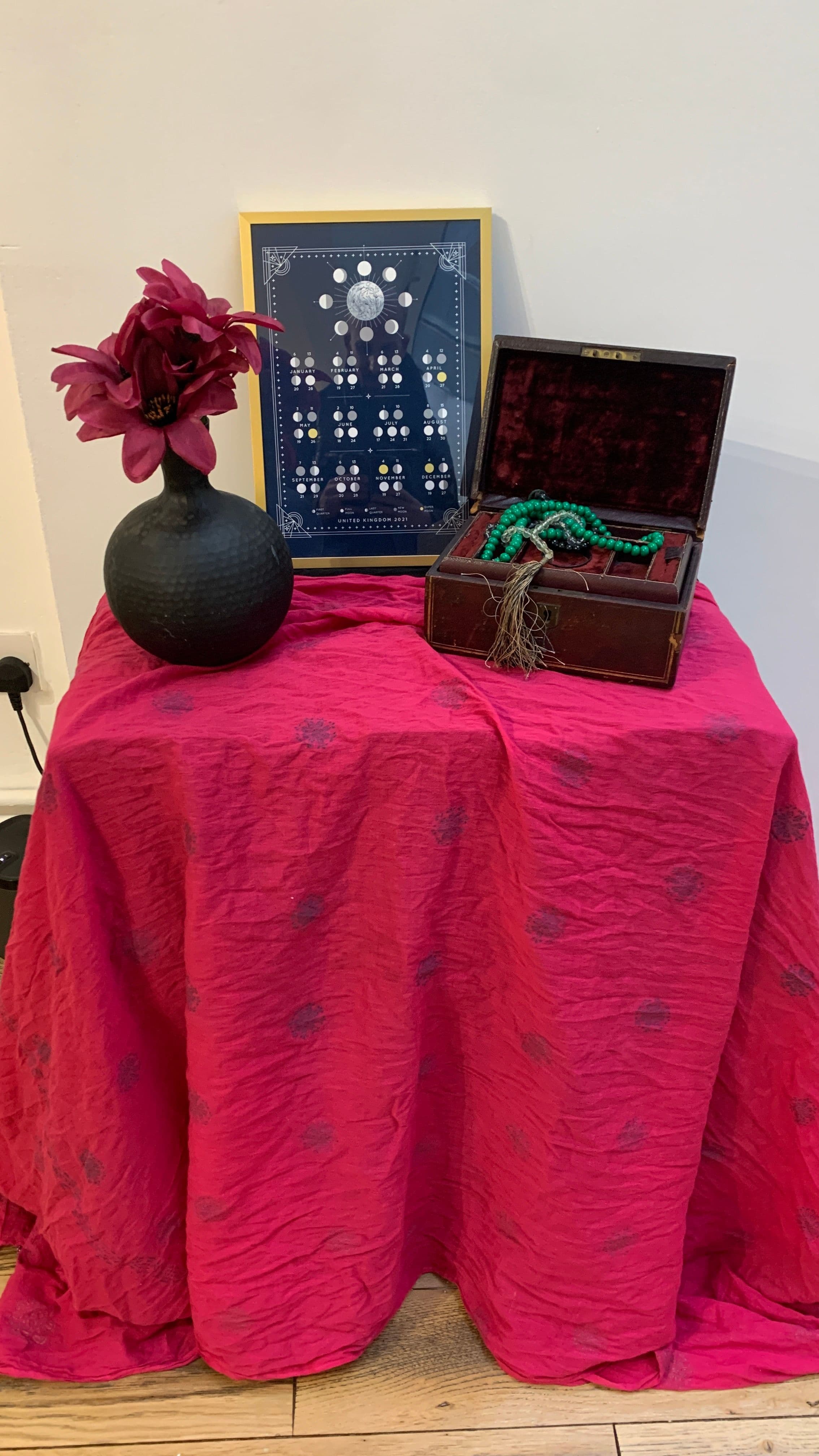 table with red cloth and ornaments
